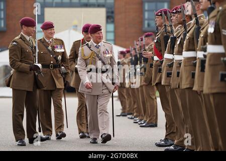 The Prince of Wales, Colonel on Chief, inspects the front rank of representatives from 1st, 2nd and 3rd Battalions of the Parachute Regiment during a ceremony to present new colours to the Regiment at Merville Barracks in Colchester. Picture date: Tuesday July 13, 2021. Stock Photo