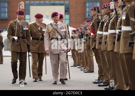 The Prince of Wales, Colonel on Chief, inspects the front rank of representatives from 1st, 2nd and 3rd Battalions of the Parachute Regiment during a ceremony to present new colours to the Regiment at Merville Barracks in Colchester. Picture date: Tuesday July 13, 2021. Stock Photo