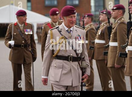 The Prince of Wales, Colonel on Chief, inspects the front rank of representatives from 1st, 2nd and 3rd Battalions of the Parachute Regiment during a ceremony to present new colours to the Regiment at Merville Barracks in Colchester. Picture date: Tuesday July 13, 2021. Stock Photo