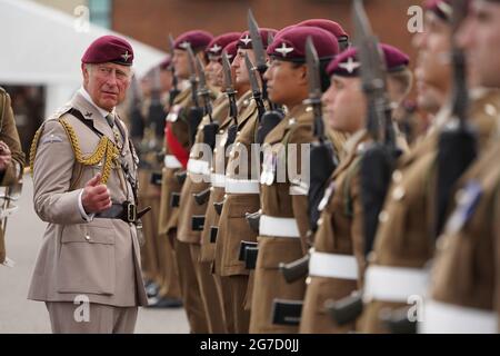 The Prince of Wales, Colonel on Chief, inspects the front rank of representatives from 1st, 2nd and 3rd Battalions of the Parachute Regiment during a ceremony to present new colours to the Regiment at Merville Barracks in Colchester. Picture date: Tuesday July 13, 2021. Stock Photo