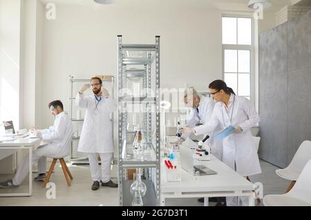 Medical research scientists working at laboratory using advanced equipment Stock Photo