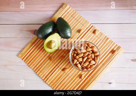top view of avocado and almond nut on table  Stock Photo