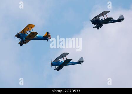 Merville Barracks, Colchester, Essex, UK. 13th Jul, 2021. A presentation of new colours for the British Army Parachute Regiment took place at their Merville Barracks base in Colchester, with a flypast of veteran and current Royal Air Force and British Army aircraft. A Boeing Stearman and two Tiger Moth biplanes were followed by two Army Air Corps Apaches and an Airbus A400M transport plane. A parachute drop then followed onto the base. Colonel In Chief, The Prince of Wales presented the new Colours to the 1st, 2nd and 3rd Battalions of The Parachute Regiment. Stock Photo