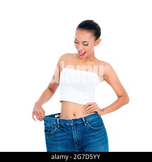 Young Asian woman losing weight by living healthy Stock Photo