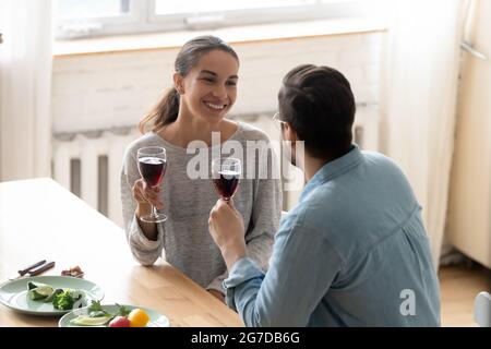 Husband makes a toast to wife during family holiday celebration Stock Photo
