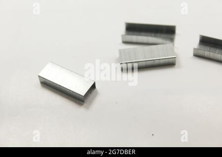 Stapler pin on isolated surface, new image Stock Photo