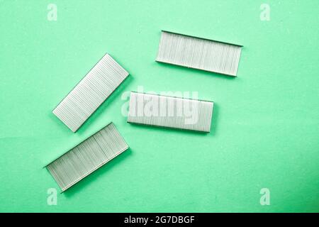 Stapler pin on isolated surface, new image Stock Photo