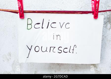 Motivational word written on paper, hand written Stock Photo