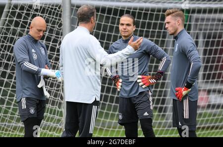 13 July 2021, Hessen, Frankfurt/Main: Goalkeeper coach Klaus Thomforde (2nd from left) speaks to goalkeepers Svend Brodersen (1st from left), Luca Plogmann (3rd from left) and Florian Müller (4th from left) during the final training session of the German Olympic football team at Frankfurt Stadium. The Olympic Football Tournament in Tokyo will take place from 22 July to 7 August. Photo: Arne Dedert/dpa Stock Photo