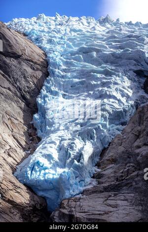 Briksdal or Briksdalsbreen glacier with melting blue ice, Norway nature landmark close-up view Stock Photo