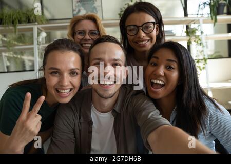 Happy excited diverse business team, employees of different generations Stock Photo
