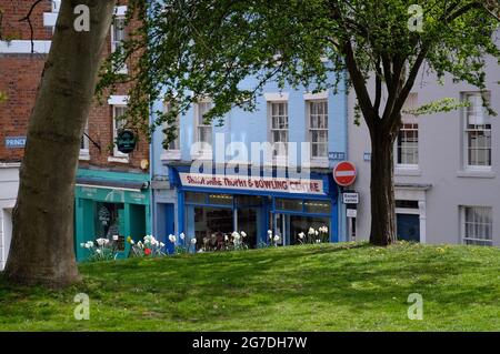 Shropshire Trophy and Bowling Centre shop on Milk Street, Shrewsbury, Shropshire, England. Seen from old St Chad's churchyard in spring Stock Photo