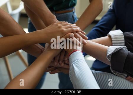 Business team stack of hands. Employees joining hands together Stock Photo