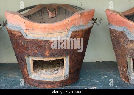 Ancient charcoal cooking stove, Asian style. Commonly used in Southeast Asia countries. Stock Photo