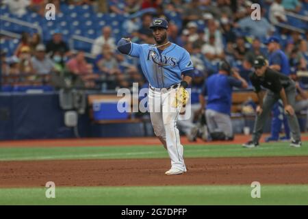 Tampa Bay Rays' Yandy Diaz steps into the batters box, wearing a rainbow  arm band as the Rays celebrate Pride day, during a baseball game against  the Texas Rangers Saturday, June 10