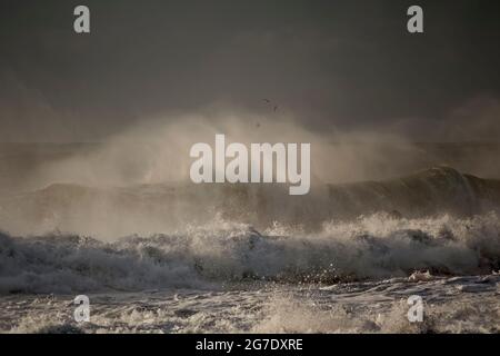 Breaking wave with wind spray. Northern portuguese coast during winter. Stock Photo