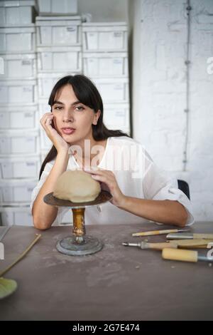 An artist during a pottery class Stock Photo