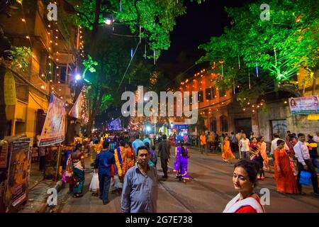 KOLKATA , INDIA - OCTOBER 18, 2015 : Night image of decorated street of Kolkata, shot at colored light, during Durga Puja festival, West Bengal, India Stock Photo