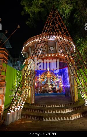 KOLKATA , INDIA - OCTOBER 18, 2015 : Night image of decorated Durga Puja pandal, shot at colored light, at Kolkata, West Bengal, India. Durga Puja is Stock Photo