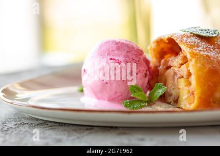 Piece of apple pie served with ice cream Stock Photo