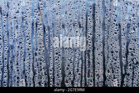 Texture of rain drops on wet transparent surface. Misted glass. Stock Photo