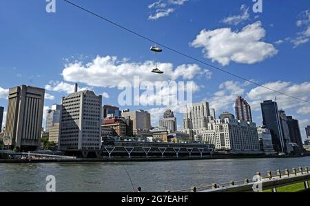 Shoefiti with Manhattan skyline seen from Roosevelt Island, in New York City. Stock Photo