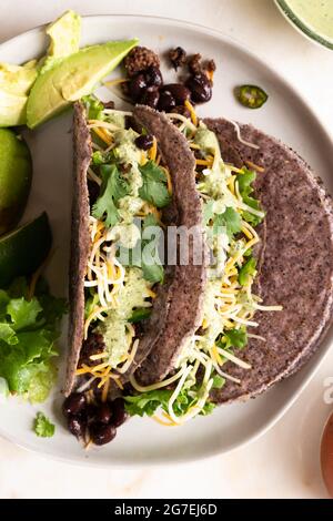 Hard Shell Tacos on a white plate Stock Photo