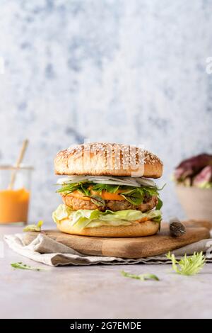 A Jackfruit burger served in a sesame seed bun, wth copy space Stock Photo