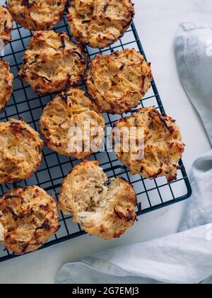 Savory meat muffins on cooling rack. Homemade delicious muffins with chicken, potatoes and eggs without flour and cheese. Paleo diet and lunch to-go m Stock Photo