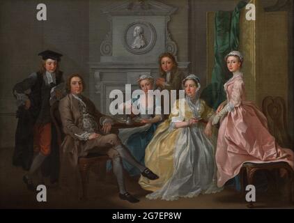 Jonathan Tyers and his family. Jonathan Tyers (1702-1767). Proprietor of Vauxhall Gardens from 1728. Painting by Francis Hayman (1708-1776) showing Tyers (seated) with Thomas Tyers (eldest son, standing behind him), Elizabeth Tyers (daughter; seated, serving a cup of tea), Elizabeth Tyers (his wife; seated, wearing an ochre dress) and Margaret Tyers (daughter, wearing a pink dress). Oil on canvas (77,8 x 106,2 cm), 1740. National Portrait Gallery. London, England, United Kingdom. Stock Photo