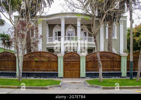 LIMA, PERU - Jul 02, 2021: The facade of beautiful ancient house in colonial style. Stock Photo