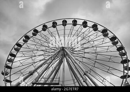 POZNAN, POLAND - Nov 26, 2017: A grayscale of the high Ferris wheel at the yearly Christmas market in Poznan, Poland Stock Photo