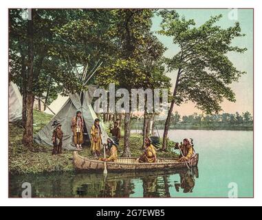 1900s 'The return of the hunters Hiawatha “ Detroit Photographic Co., c1904.  Photochrom, color. The Return Of The Hunters MInnesota, 1904 photochrom of the Native American Ojibwa hunters returning to their camp in their birchbark canoe. Stock Photo