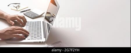 Man using laptop, accountant working in the office. Image background with copy space Stock Photo