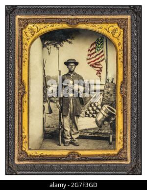 CIVIL WAR 1860's African American soldier in Government Union uniform official Civil War keepsake Portrait with a Austrian Lorenz rifle-musket & Remington revolver in front of painted backdrop showing weapons and American flag at Benton Barracks, Saint Louis, Missouri] Enoch Long 1823-1898, photographer Stock Photo