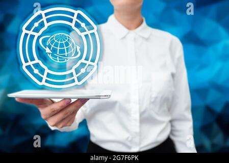Lady In Uniform Standing Holding Tablet In Hand Presenting Virtual Modern Technology. Business Woman Carrying Tab Pointing For New Futuristic Tech. Stock Photo