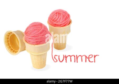 Pink yarn balls in ice cream cone with summer text isolated on white Stock Photo