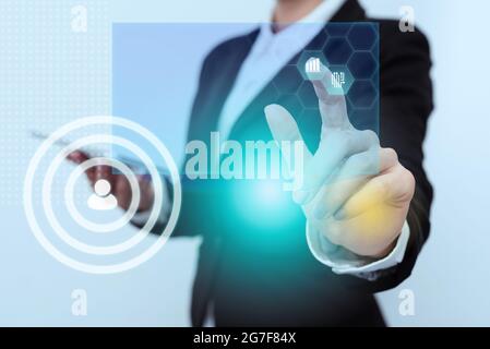 Woman In Uniform Side Standing Carrying Phone Tapping Futuristic Virtual Display Icons. Lady In Suit Holding Mobile Device Touching Innovative And Stock Photo