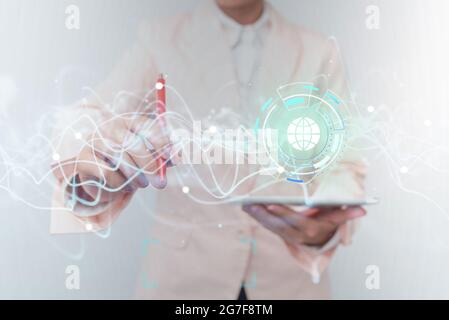 Lady In Uniform Using Futuristic Digital Mobile Interface Technology. Woman Holding Phone And Pen Interacting With Advanced Holographic Display Screen Stock Photo