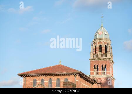Exterior of a tower on top of an old building with bricks Stock Photo