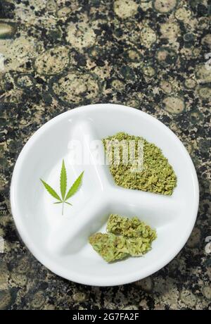 Tray with marijuana and digital scale with cannabis bud. Top view of wooden  table with sun rays Stock Photo - Alamy