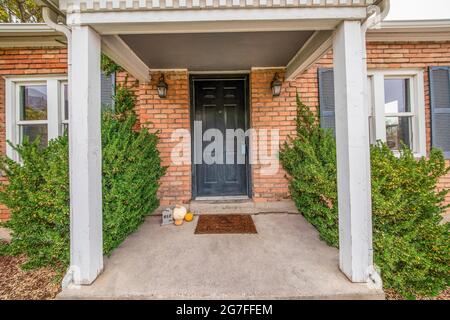 Front door exterior with minimalist halloween decoration Stock Photo