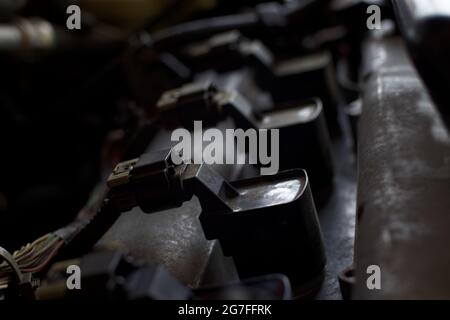 Chevy Cobalt spark plug caps and wires on a car motor close up Stock Photo