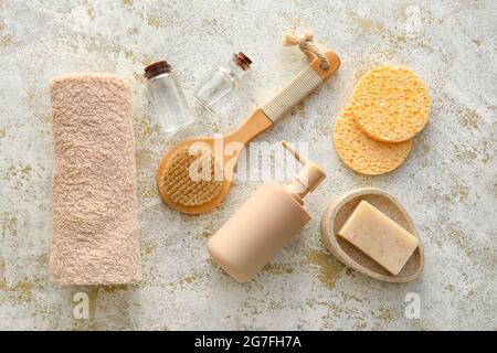 Composition with sponges and bath supplies on grunge background Stock Photo