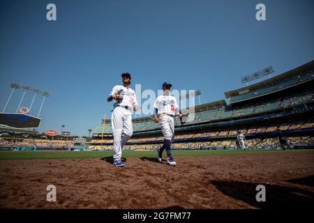 Los Angeles Dodgers outfielders Mookie Betts (50) and Cody Bellinger (35) walk off the field during an MLB regular season game against the Arizona Dia Stock Photo