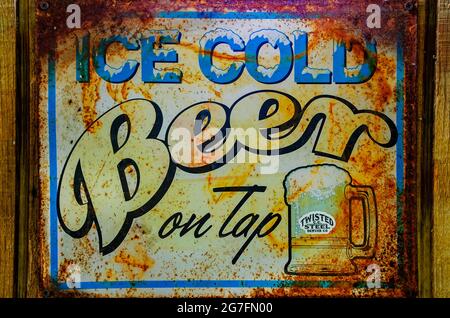 A vintage ice-cold beer sign hangs at The Shed Barbeque and Blues Joint, July 4, 2021, in Ocean Springs, Mississippi. Stock Photo