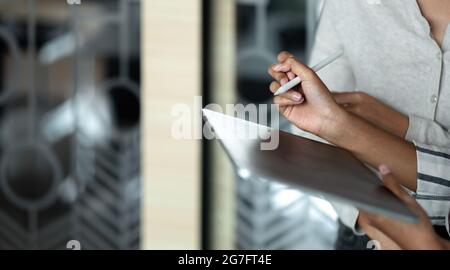 Creative idea teamwork concept. Group of asian woman using digital tablet and pen stylus drawing at office Stock Photo