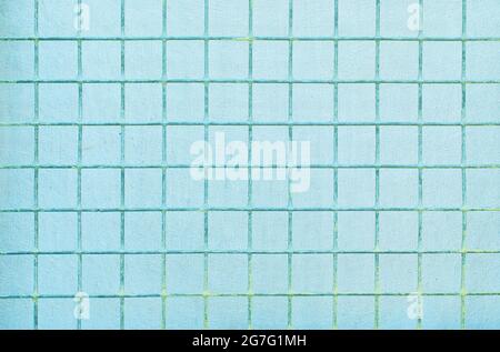 The background is made of blue metal mesh and coarse fabric.  Stock Photo