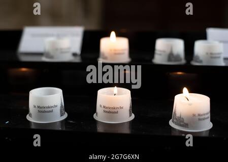 Stralsund, Germany. 23rd June, 2021. Candles are burning in St. Mary's Church. Credit: Stephan Schulz/dpa-Zentralbild/ZB/dpa/Alamy Live News Stock Photo
