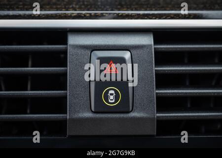 Detail on car dashboard, the emergency lights button inside a car close-up Stock Photo